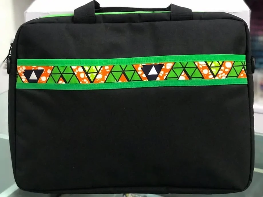 Handmade Souvenir Bags in Nigeria | Unique + Personalized 5 Black African print laptop bag with jeans material.