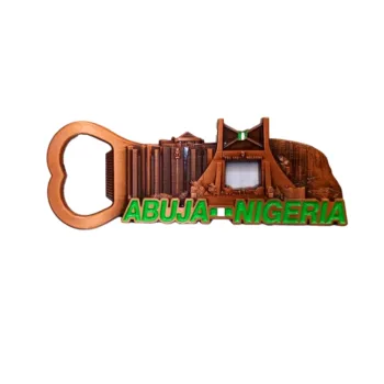 Intricate metal bottle opener featuring detailed Abuja skyline with iconic landmarks