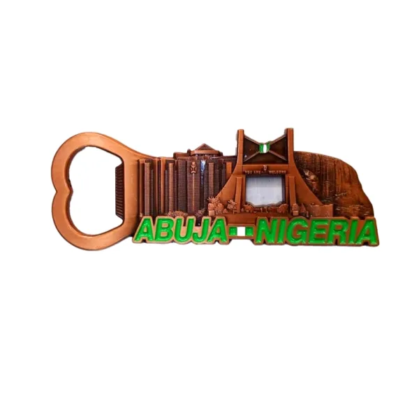 Intricate metal bottle opener featuring detailed Abuja skyline with iconic landmarks