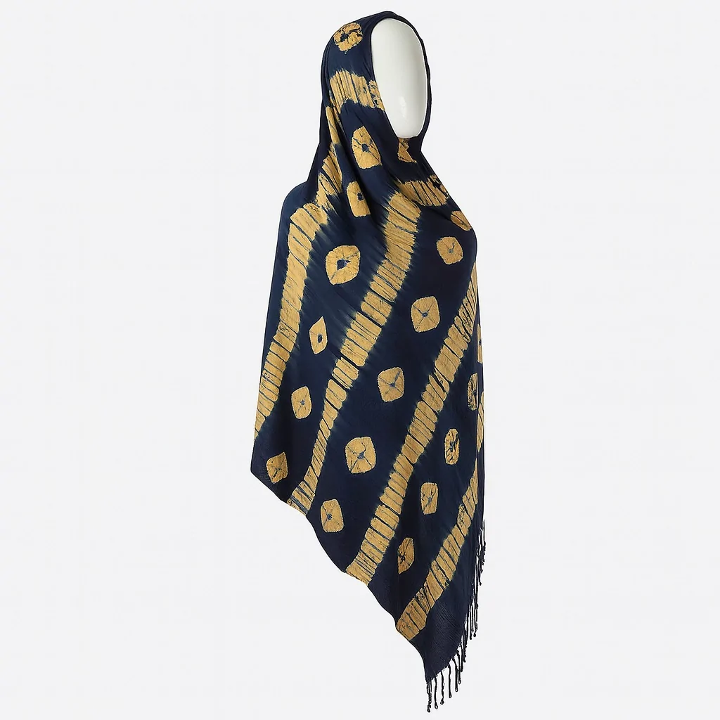Navy Adire scarf with diagonal golden stripes and circular motifs, displayed on a mannequin in side profile.