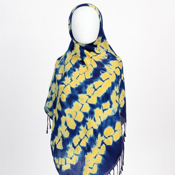 Blue Adire scarf with scattered yellow tie-dye patterns, draped in front view on a mannequin.