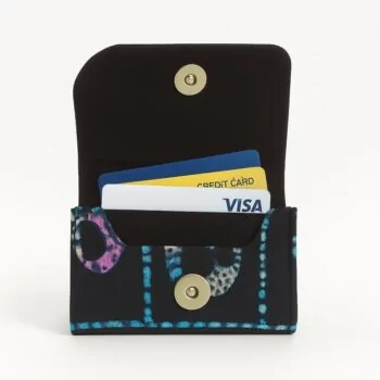 Ankara African print card holder with blue dotted patterns, open with credit cards inside.