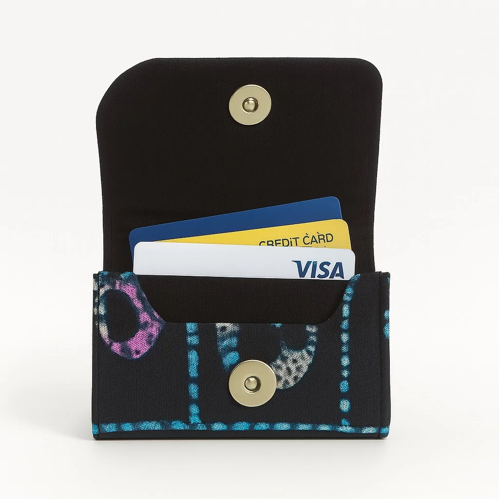 Ankara African print card holder with blue dotted patterns, open with credit cards inside.