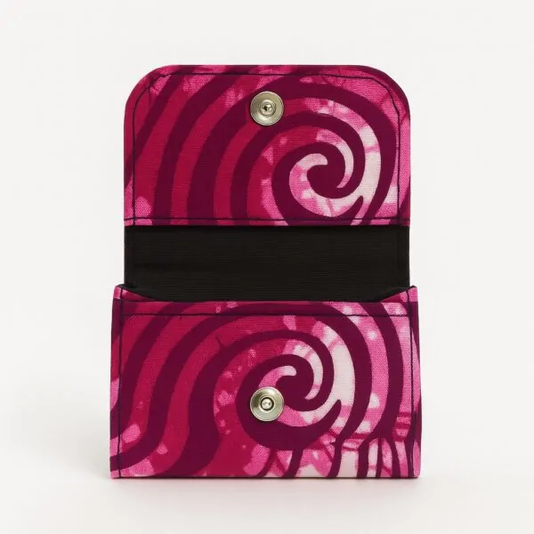 Open Ankara African print card holder with pink swirl patterns and snap button closure.