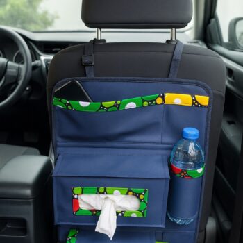 Full view of navy blue car organizer with green, yellow, red Ankara trim, mounted on car seat with compartments for bottle, tissue, and phone.