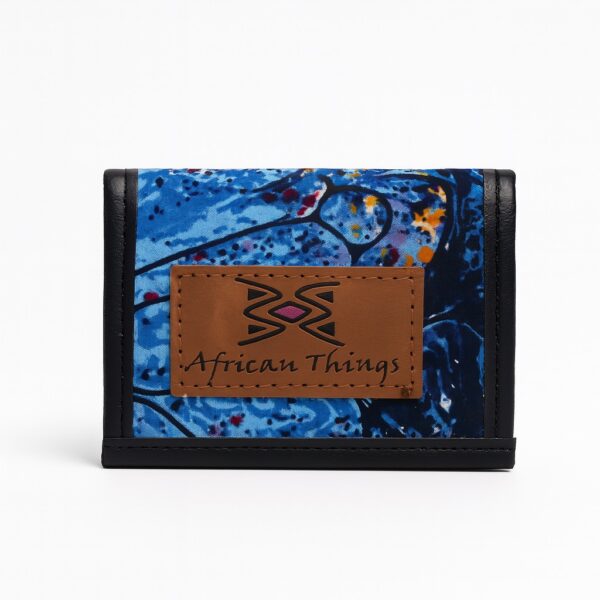 African print blue patterned African Things wallet with brown leather logo patch.