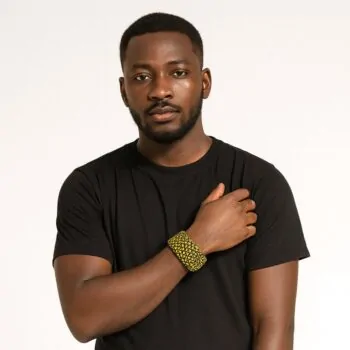 Handsome Black man wearing a black T-shirt and modeling a yellow and black triangle patterned Ankara bangle.