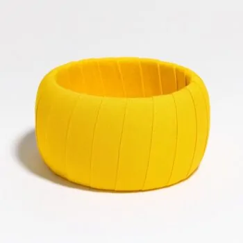 Solid yellow Ankara fabric bangle with vertical pleated texture, displayed on a clean white background.
