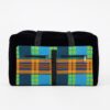 Front view of a collapsible duffel bag with bold African Ankara print in blue, orange, and green checkered patterns, dual front zip pockets, and black canvas base with short black handles. Studio white background.