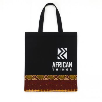 Black tote bag with "African Things" logo and Ankara fabric strip at the base