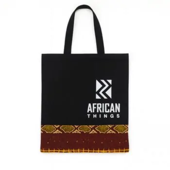 Black tote bag with "African Things" logo and Ankara fabric strip at the base