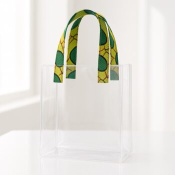 Transparent acrylic tote bag with green and yellow Ankara print handles. Transparent wedding souvenir bags Nigeria.