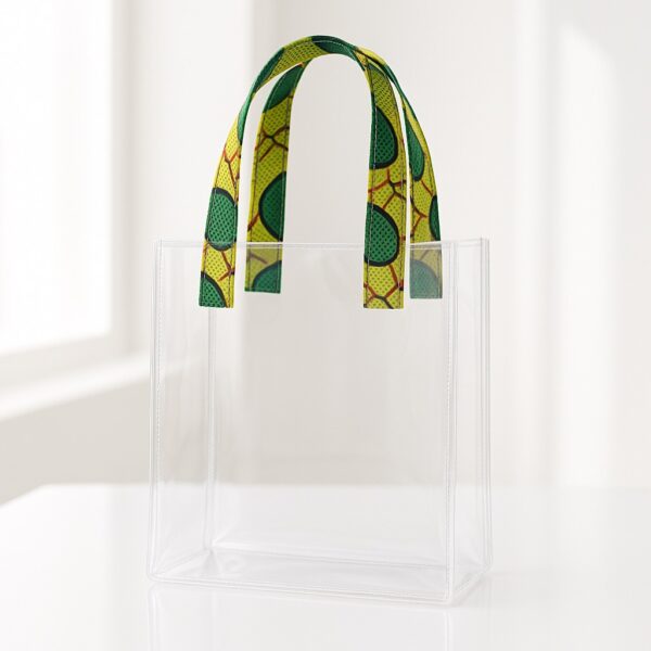 Transparent acrylic tote bag with green and yellow Ankara print handles. Transparent wedding souvenir bags Nigeria.
