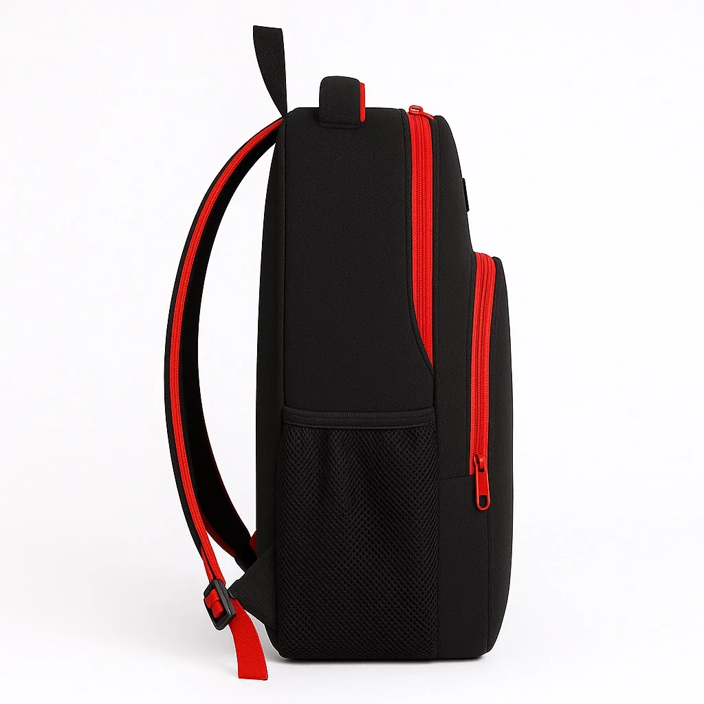 Side angle of a durable black school backpack featuring bold red trim and a mesh water bottle holder, designed for everyday student use.