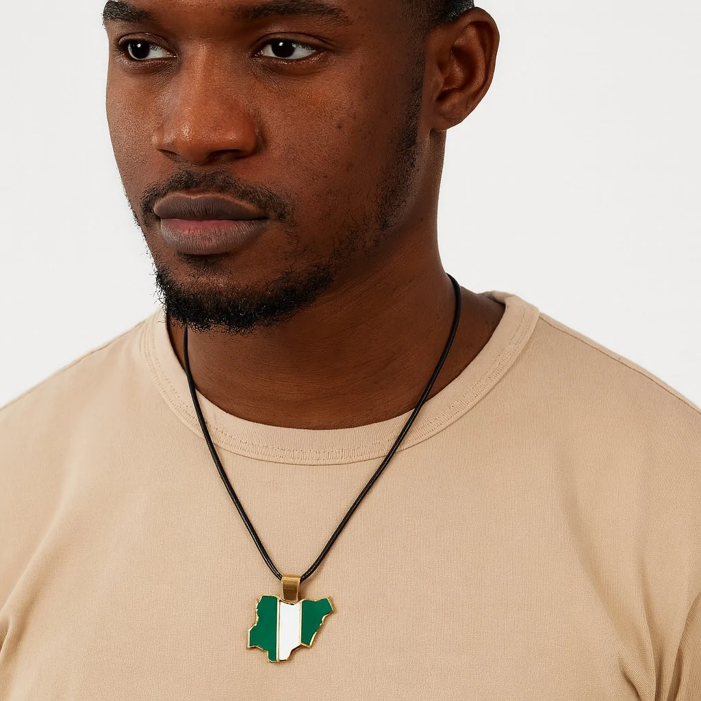 African male model wearing a Nigeria map-shaped necklace pendant.