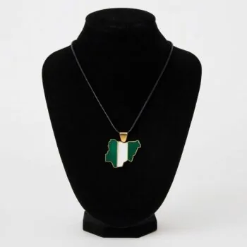 Nigeria map-shaped pendant necklace with black cord displayed on a black velvet jewelry stand.