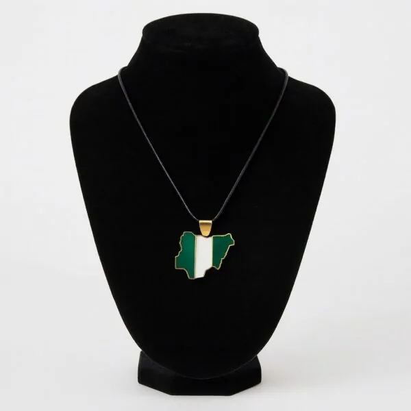 Nigeria map-shaped pendant necklace with black cord displayed on a black velvet jewelry stand.