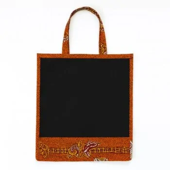 Black tote bag with orange Ankara print border and decorative base