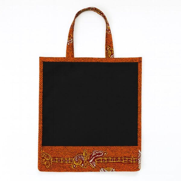 Black tote bag with orange Ankara print border and decorative base