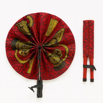 Red Ankara hand fan featuring golden elephant motifs and abstract vine patterns. Presented fully open and folded, with black leather binding.