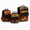 Three-piece set of African print backpacks – A group of three structured backpacks in small, medium, and large sizes, featuring bold Kente-inspired print in yellow, orange, green, and red, combined with black leather panels and pockets, displayed on a clean white background.
