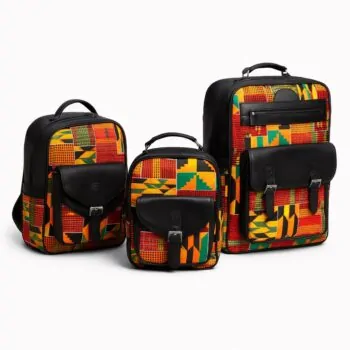 Three-piece set of African print backpacks – A group of three structured backpacks in small, medium, and large sizes, featuring bold Kente-inspired print in yellow, orange, green, and red, combined with black leather panels and pockets, displayed on a clean white background.
