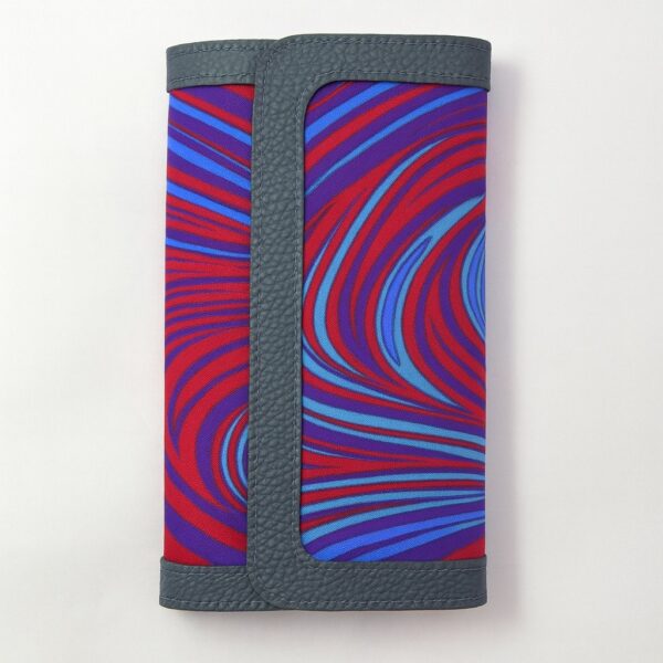 Single African print Ankara ladies' purse – bold swirling red, blue, and purple pattern with dark grey leather trim, displayed upright on a white background.