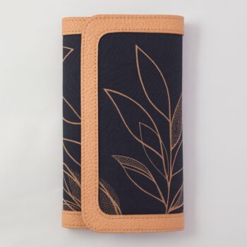 Single African print Ankara ladies' purse – deep navy fabric with golden leaf outline design and tan leather trim, displayed upright on a white background.