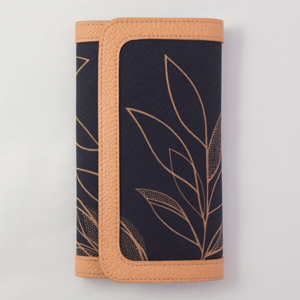 Single African print Ankara ladies' purse – deep navy fabric with golden leaf outline design and tan leather trim, displayed upright on a white background.