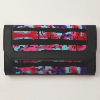 Single African print Ankara ladies' purse – abstract red, turquoise, purple, and black watercolor-style pattern with black leather trim, displayed on a white background.