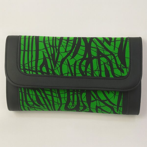 Single African print Ankara ladies' purse – green background with bold black abstract line pattern, finished with black leather trim, displayed on a white background.