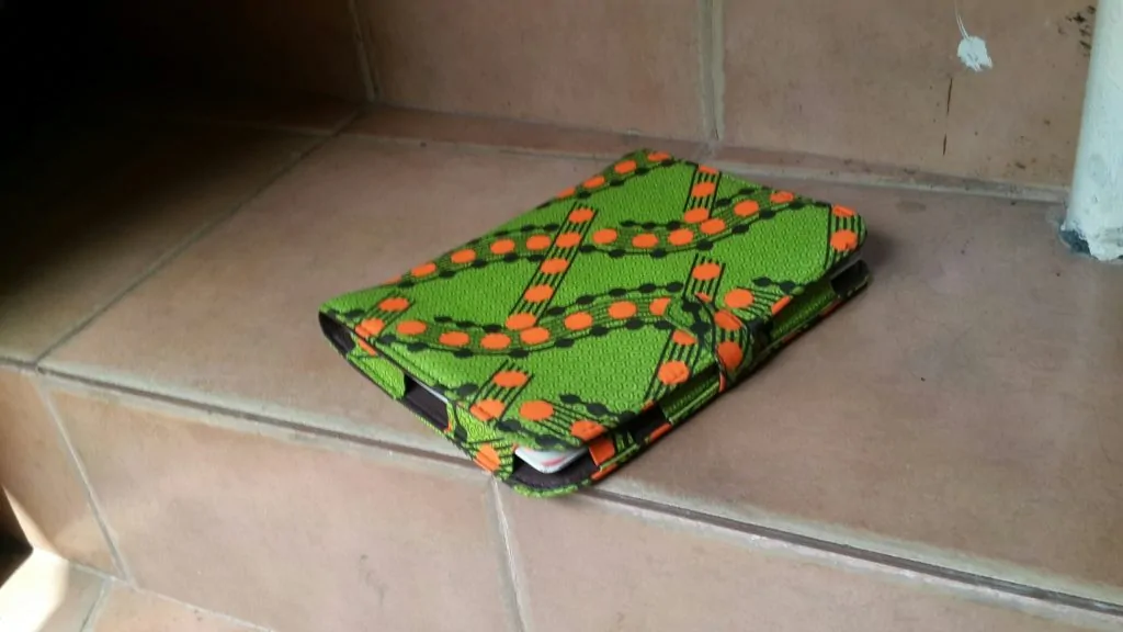 An Ankara/African print styled iPad case on the floor. Great for souvenir Ideas for corporate events & business.