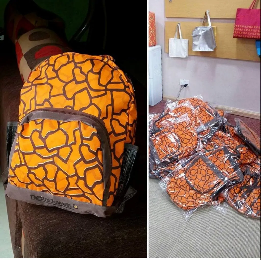 Completed Ankara school bag design and a collection of school bags on the floor.