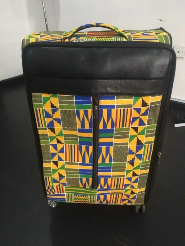An African leather suitcase with black, yellow, and blue patterned design. Great for souvenir Ideas for corporate events & business.