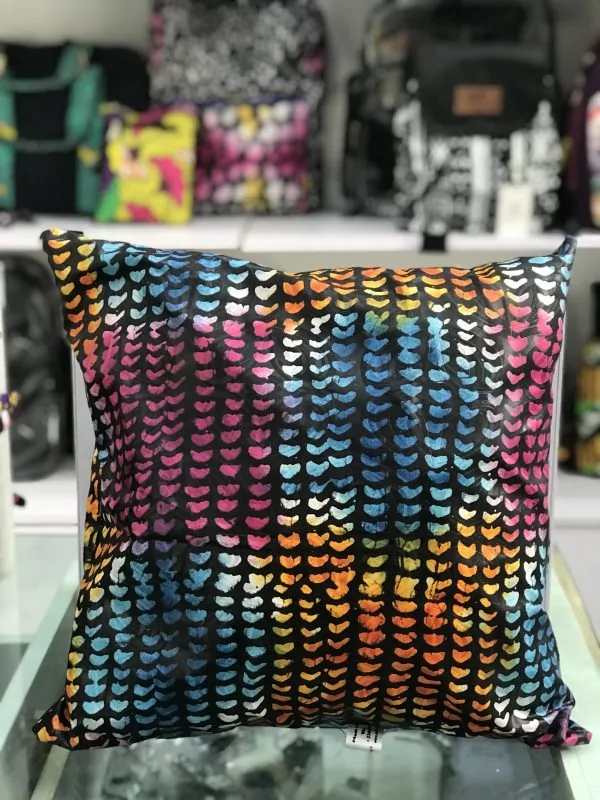 Ankara print pillow with vibrant colorful patterns.