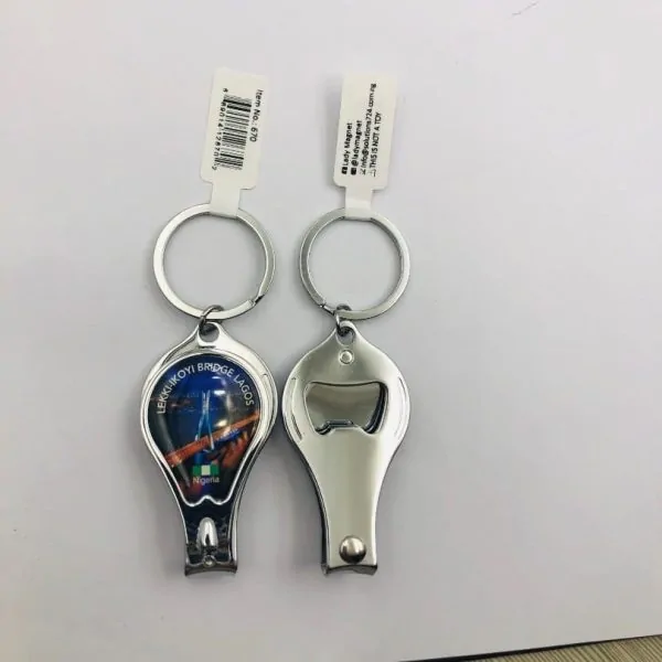 A nail clipper/key chain with a picture.