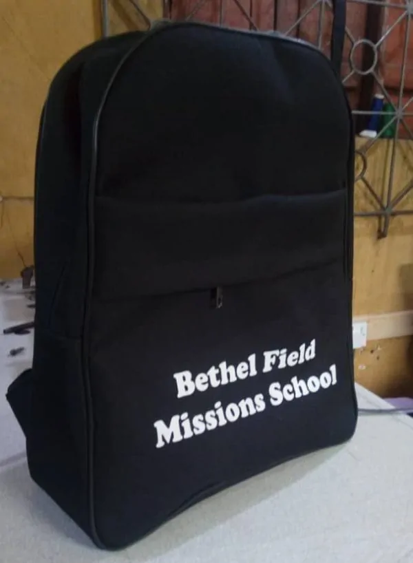 Handmade Souvenir Bags in Nigeria | Unique + Personalized 12 Black Budget Buddy school bag.