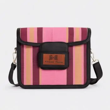Close-up front view of a pink and maroon Aso Oke side bag featuring the "African Things" leather logo patch.