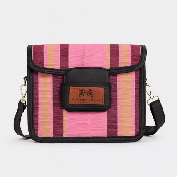 Close-up front view of a pink and maroon Aso Oke side bag featuring the "African Things" leather logo patch.