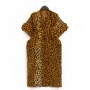 Back view of an orange and black leopard print kimono with a belt.