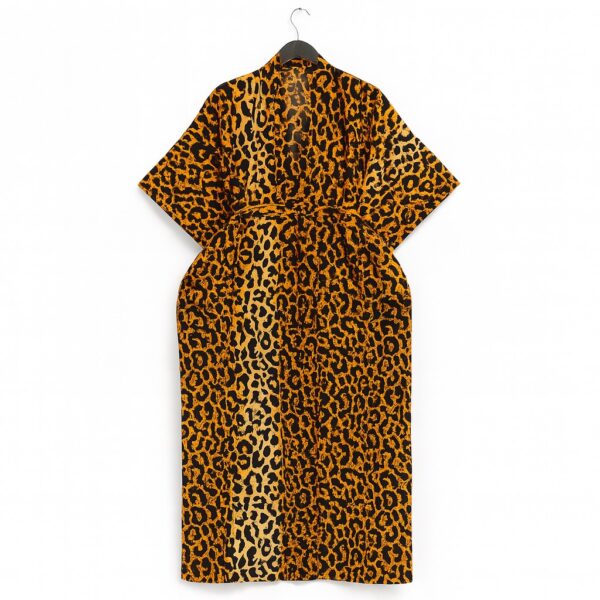 Back view of an orange and black leopard print kimono with a belt.