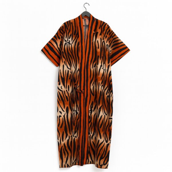 Orange and black tiger-striped kimono with wide sleeves and a front tie on a hanger.