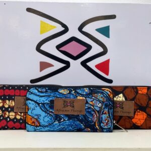 Vibrant African print female wallet with colorful patterns, multiple compartments, and a secure closure for style and functionality.