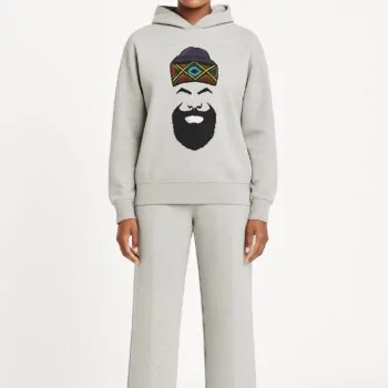 Model wearing a grey African print men/women hoodie and pants set.