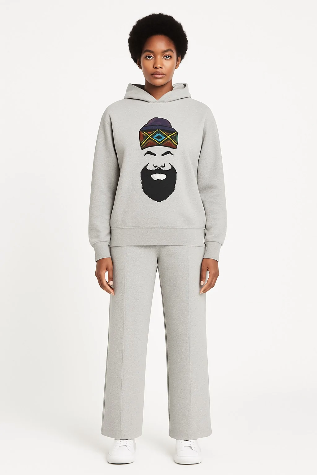 Model wearing a grey African print men/women hoodie and pants set.