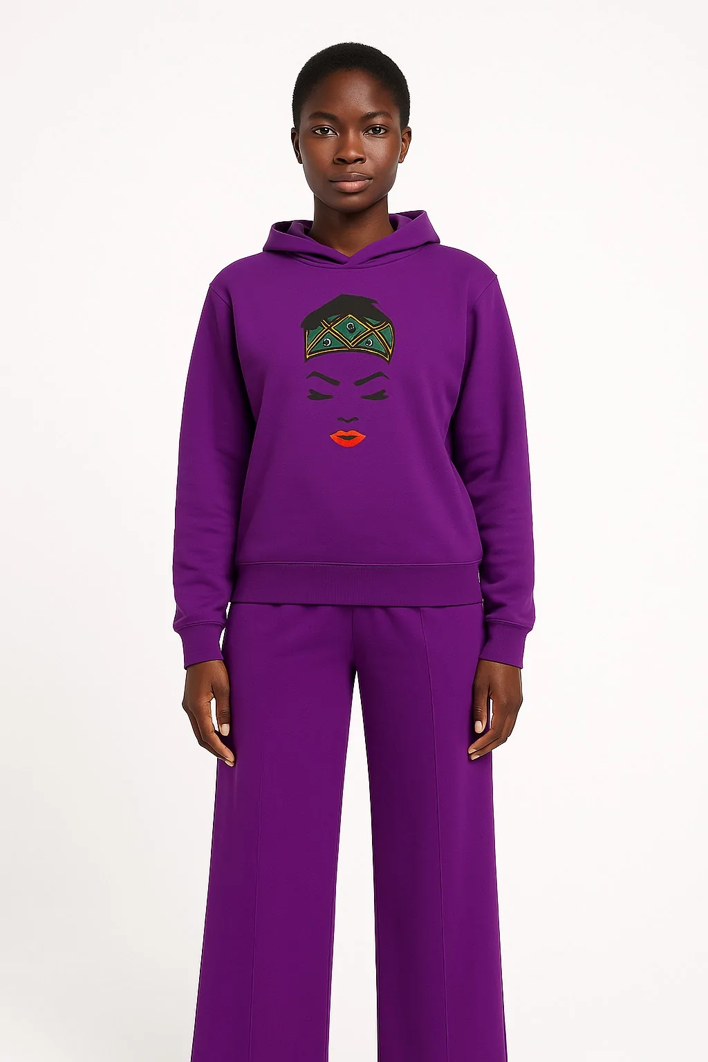 Model wearing a purple African print hoodie and pants set.