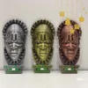 Three African masks in different colors