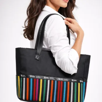 Shop the Pelumi Aso Oke Tote Bag at African Things. A durable laptop bag for ladies featuring 15x12.5" size, zipper closure, and protective base studs. Buy now!