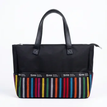 Shop the Pelumi Aso Oke Tote Bag at African Things. A durable laptop bag for ladies featuring 15x12.5" size, zipper closure, and protective base studs. Buy now!