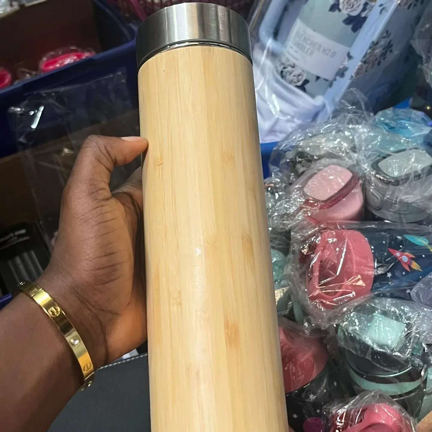 A bamboo vacuum flask with a stainless steel inner liner